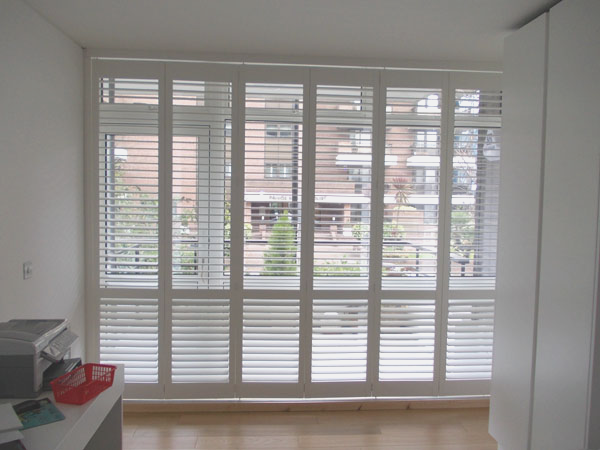 Full Height Plantation Shutters with track for balcony door in Central London installed by Select Shutters